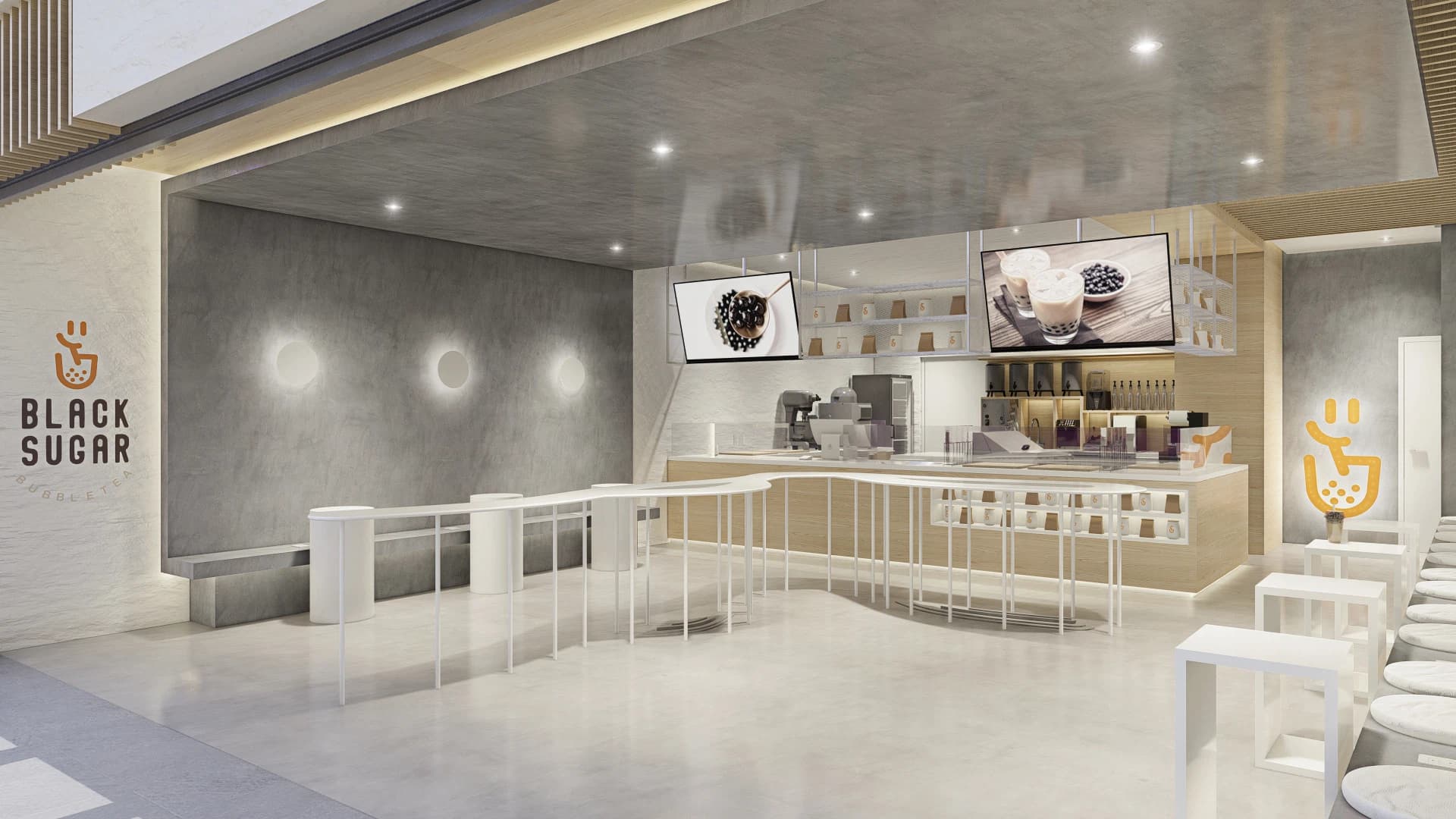 Interior de local de bubble tea Black Sugar con barra curva blanca y pantallas
