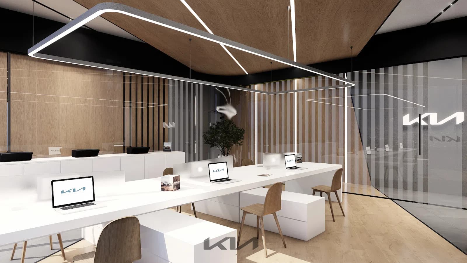 Mesa de trabajo abierta de oficinas KIA con laptops y lámpara LED perimetral